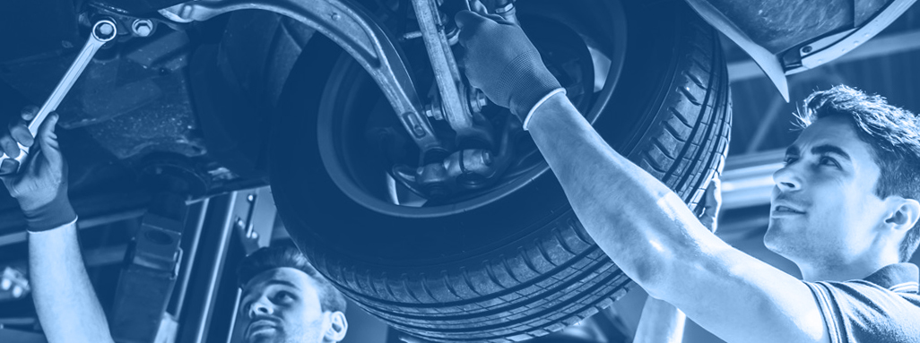 Mechanics fitting a tyre - Car Repairs Dartford